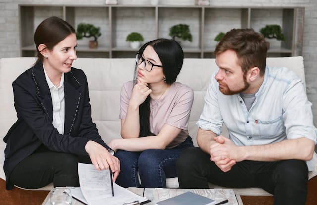 a property manager speaking with two tenants